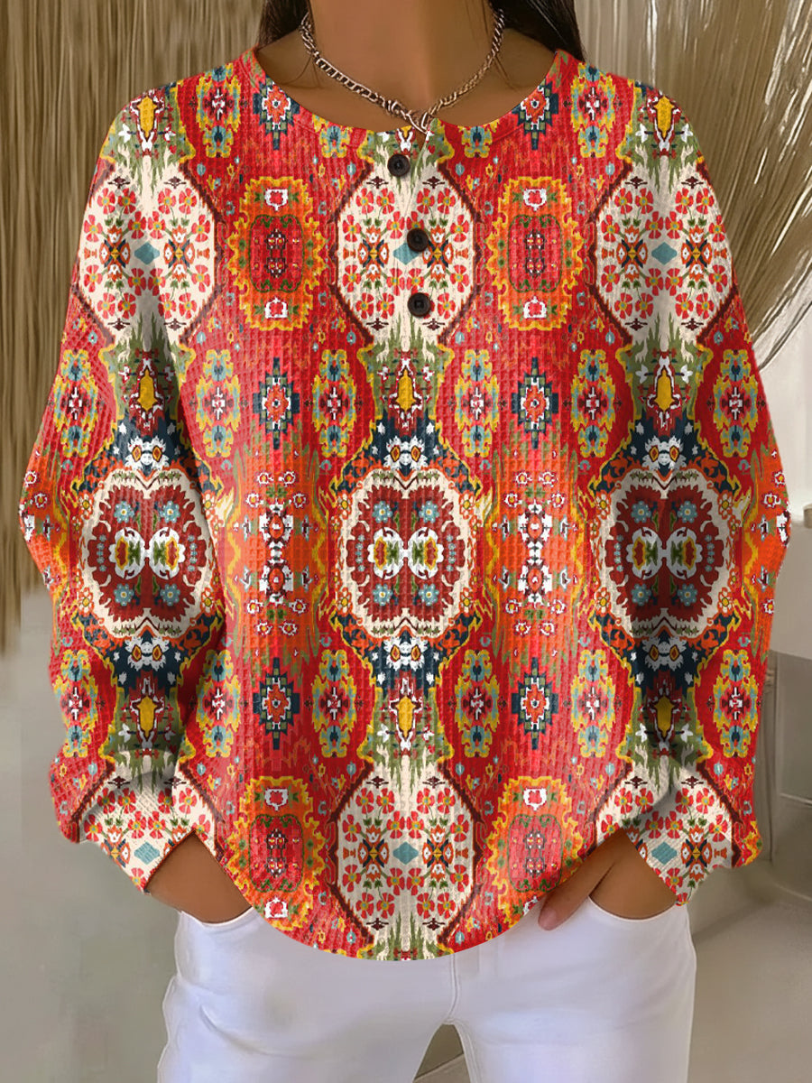 Suéter con estampado floral étnico
