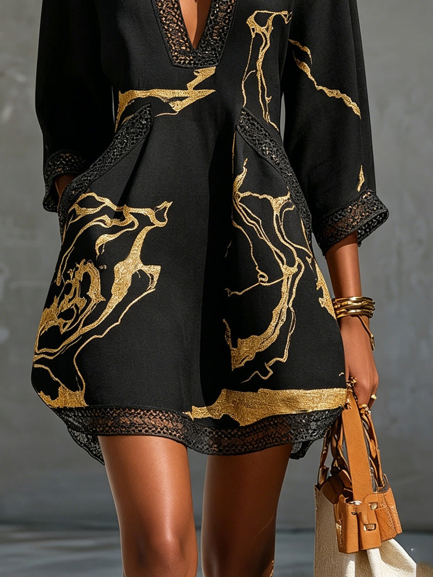 Ébène | Black & Gold V-Neck Mini Dress