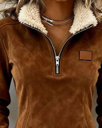 Sudadera con cuello de media cremallera, diseño asimétrico y detalle de flecos