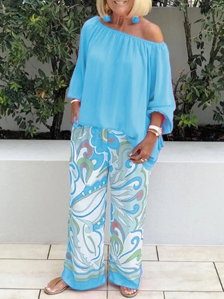 Two-piece set with women's trousers and off-shoulder top