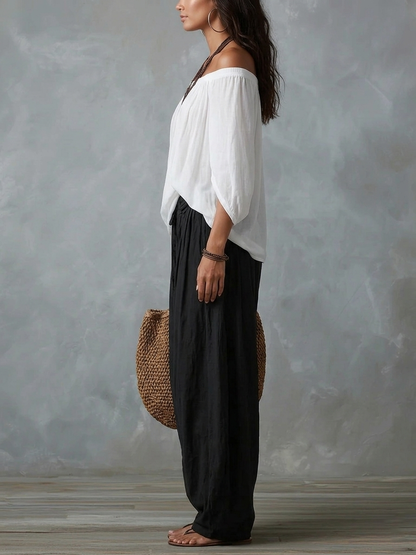 White off-shoulder top and lantern-style flared pants