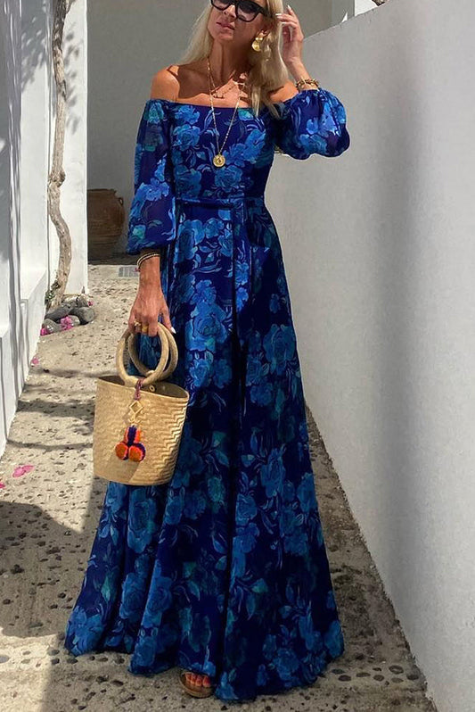 Long dress with floral pattern and off-the-shoulder sleeves