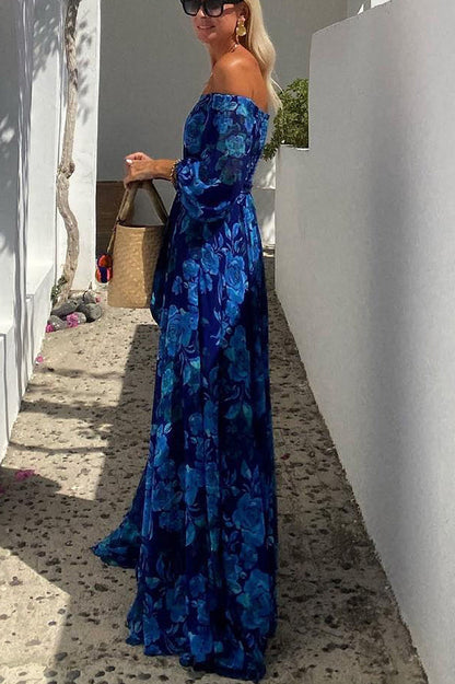 Long dress with floral pattern and off-the-shoulder sleeves